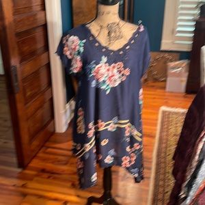 Johnny was blue floral tunic in mint condition/never worn.